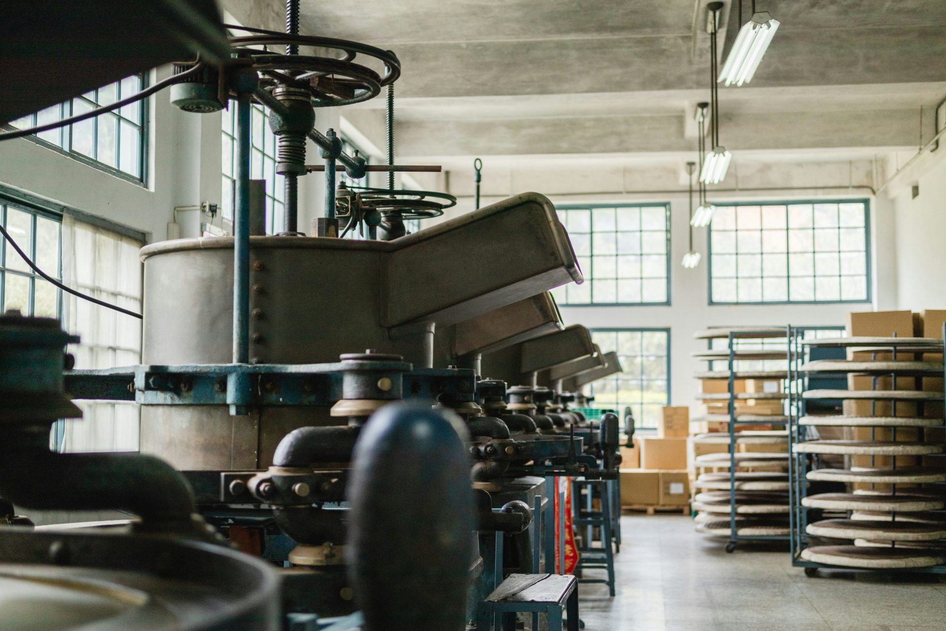 a large machine in a large warehouse filled with boxes